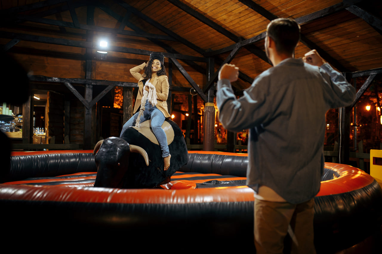 love-couple-on-rodeo-attraction-in-amusement-park-2024-11-26-09-25-43-utc